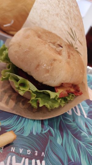 Burger. Loved the caramalized onions, and the vegan bacon. Could've used more cheese, but overall pretty tasty! at Khambú Quart in Valencia