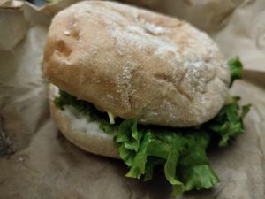 Chicken burger hiding in all that lettuce at Khambú Quart in Valencia