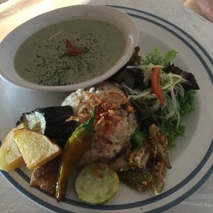 Organic vegetable curry with basil, side rice and various salad. at Teeda in Himeji
