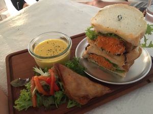 Tofu, vegetable and peanut butter sandwich with a vegan samosa and cold kabocha soup.   at Teeda in Himeji