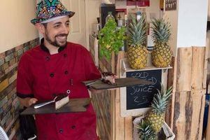 Chef Antonio serving berry cheesecake  at Piadina Genuina in East London