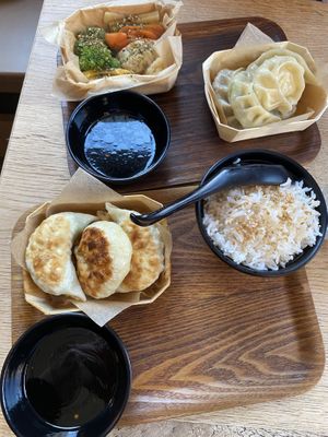Fried dumplings and sesame flavored rice. Steamed dumplings and steamed vegetables.  at Mo Mo - Saint-Gilles in Brussels