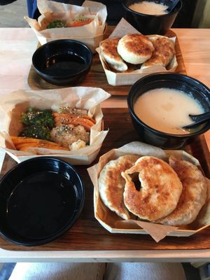 Lunch boxes with stir fried dumplings  at Mo Mo - Saint-Gilles in Brussels