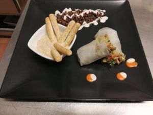 Sauted Sprout Vietnamese Roll with Red Quinoa and Roasted Black Beluga Lentils and Satay Dip at Black Salad in Vitoria Gasteiz