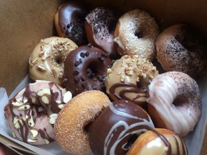 variety of donuts (chocolate, maple, strawberry, sugar, lemon) at Sane Treats in El Paso