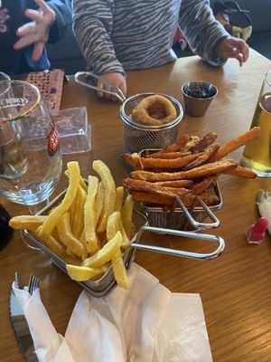 Patatas fritas, boniatos, aritos de cebolla.  at Gourmet Burger Room in Marbella