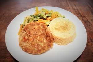 veggie burger with quinoa and sauteed vegetables at AMMA PERU in Miraflores