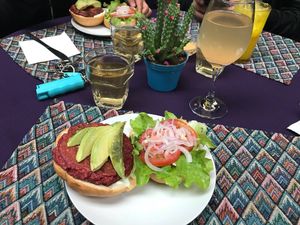 My burger with my tea and kumbucha at Flora in Quito