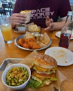 "dirty secret" burger with some pesto mac. Cauliflower wings, and a buffalo chicken wrap. at J Selby's in St Paul