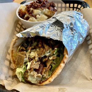 The Gyro. House-made gyro 'meat,' cucumber, lettuce, tomato & onion, drizzled with green goodness sauce then wrapped in warm pita. As a side, I had the best potato salad!   at J Selby's in St Paul