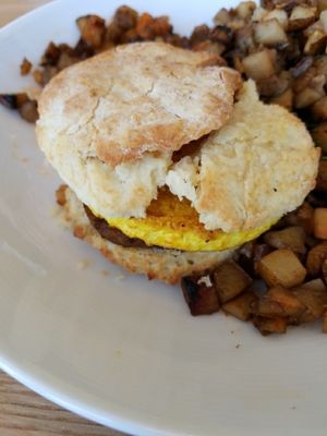 Vegan sausage and egg sandwich with potatoes  at J Selby's in St Paul