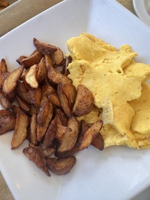 A la carte potatoes and just egg scramble (not very scrambled lol)   at J Selby's in St Paul