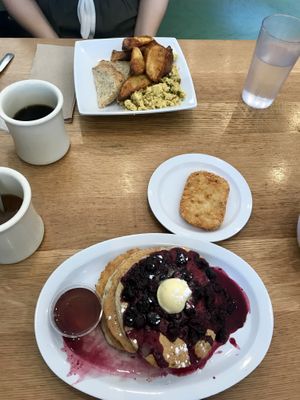 Pancakes with berry compote and breakfast scramble with potatoes, and hash patty at J Selby's in St Paul