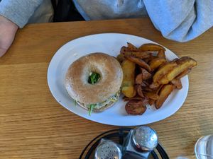 Veggie breakfast bagel with amazing cream "cheese" and breakfast potatoes at J Selby's in St Paul