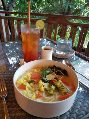 So good! Laksa Lemake (vegetable curry soup with coconut and herbs) & Strawberry Iced Tea with Spiced Palm Sugar Syrup at Herb Library  in Ubud