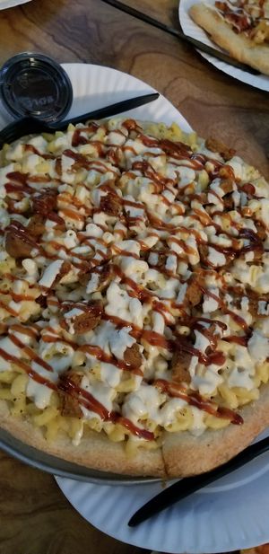 Vegan mac and cheese pizza with bbq sauce and soy sausage at Little Nook Cafe in West Sayville