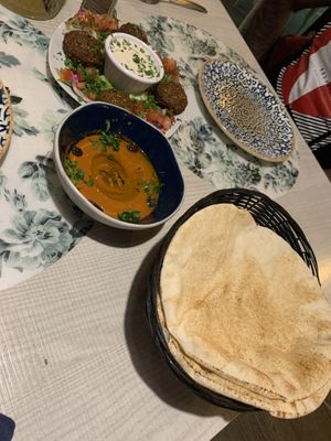 Starters - pita bread, mouhamara (red pepper and pomegranate Dip) and falafel - the white dip was vegan  at Ilili in Tenerife