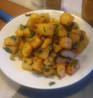 (Hot starter on Lebanese cuisine menu) Batata hara: Potatoes with garlic, cilantro, lemon and spice at Ilili in Tenerife
