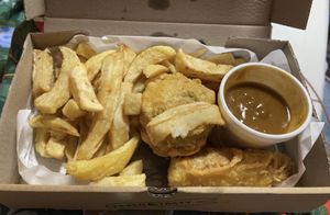 Vegan selection box: chips, battered sausage, nuggets, pea fritter and curry sauce!  at Ranmoor Friery in Sheffield