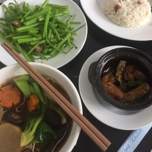 Noodle soup with vegetables, stir fried water spinach with garlic, tofu skins in black pepper sauce & coconut fried rice. at Veggie Saigon - Vietnam & Thai Vegan Restaurant in Ho Chi Minh City