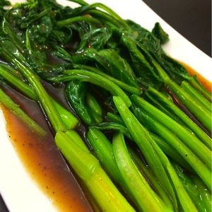Cải ngồng sốt ngũ vị (Chinese broccoli with 5-spice-sauce) at Veggie Saigon - Vietnam & Thai Vegan Restaurant in Ho Chi Minh City