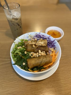 Bún chà giò (vermicelli noodles with spring rolls and veggies— $1.62USD) & iced coffee  at Veggie Saigon - Vietnam & Thai Vegan Restaurant in Ho Chi Minh City