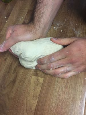 kneading pizza dough at Sazzy & Fran in East London