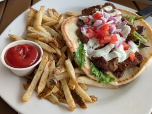 Vegan Gyro: housemade Greek seasoned seitan, tzatziki, tomatoes, red onion & lettuce on pita, served w/ house cut fries at Benson Brewery in Omaha