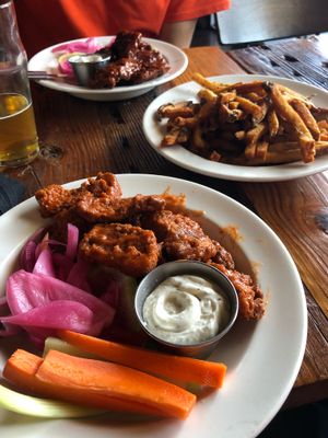 Two types of vegan wings with vegan ranch and fries  at Benson Brewery in Omaha