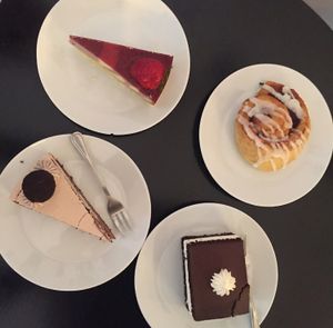 fererro rocher cake, cocoa cake with cream “wuzetka”, cheesecake (with tofu) “tofurnik” and cinnamon bun at Lokal Dela Krem in Warsaw