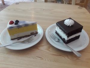 Cashew nut based cake (left. WZ cake (right) at Lokal Dela Krem in Warsaw