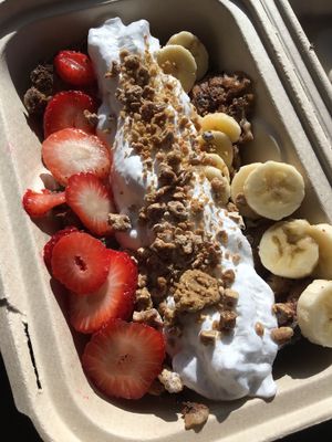 French toast topped with banana cream, coconut whipped cream, fruit & date sunflower butter crumble. Organic & Gluten-free  at Greens Please Wellness Kitchen in Poway
