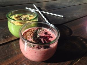 Smoothie bowls: berry-banana with lavender and pear-cucmber-lemon with banana chips. Paper straws! at Marta Kohvik in Tallinn