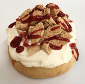 Strawberry Cheesecake Roll! Cream Cheese Frosting, Graham Cracker Cookies, and Strawberry Jam! at Cinnaholic - Centennial in Las Vegas