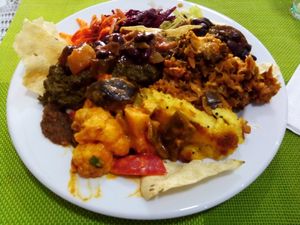 Assortment of 4 dishes and salad at Lisbon Vegan Restaurante in Lisbon