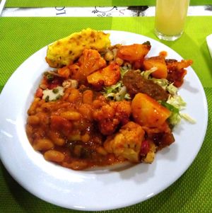 White beans, cauliflower and potatoes, mini-pizza, salads and sauces at Lisbon Vegan Restaurante in Lisbon