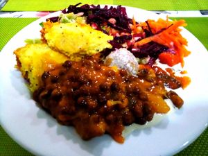 Black chickpeas, assortment of mixed vegetables and salad at Lisbon Vegan Restaurante in Lisbon