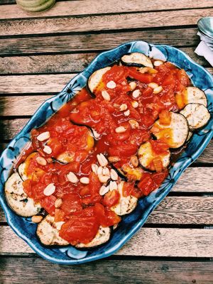 roasted eggplant with a peanut and tomato sauce   at Vibe Cafe in Phnom Penh