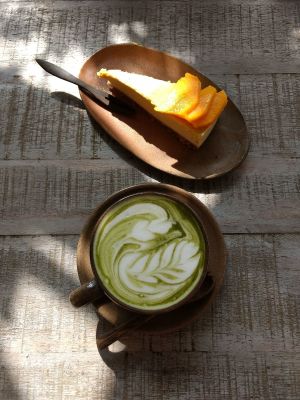 Matcha latte and mango raw cake. at Vibe Cafe in Phnom Penh