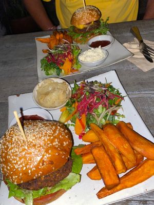 nomad burger with sweet potato fries and a side salad. Delish! at Vibe Cafe in Phnom Penh