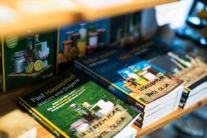 All kinds of books to help saving the world at Tante Olga - Organic Zero Waste Store in Cologne