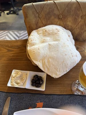 Freshly made bread with hummus and olives oil  at Constantine's Ark in Istanbul
