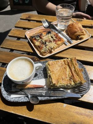 pizza, pain au chocolat, cappuccino and quiche  at VG Pâtisserie in Paris