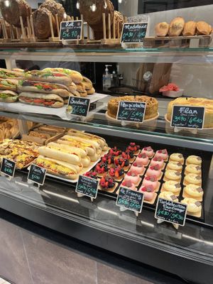 Madeleines, stuffed pastry rolls, sandwiches, paninis, pizza, flans and more patisserie   at VG Pâtisserie in Paris