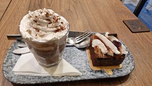 Chocolat au lait d'amande avec chantilly + forêt noire at VG Pâtisserie in Paris