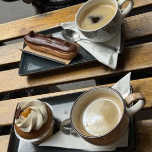 A baba (aperol spritz), a chocolate éclair, and coffees. Simply amazing, such a joy to experience a delicious éclair again after so many years of being vegan.  at VG Pâtisserie in Paris