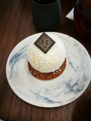le pompon blanc- dessert from white chocolate, coconut and passionfruit at VG Pâtisserie in Paris