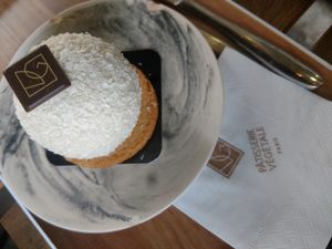 Passion fruit and mango custard inside of a coconut shell with a salted almond cookie on the bottom.. heavenly at VG Pâtisserie in Paris