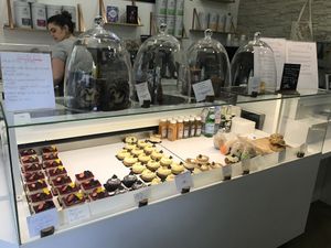 Les choix (de gauche à droite): fraisier, Jacky chocolat coco, tartelette au citron, baba au rhum rhubarbe pistache, œuf de Pâques, cake marbré, noisette, et sandwichs at VG Pâtisserie in Paris