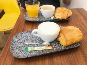 One breakfast special and one oat milk cappuccino with pain au chocolat  at VG Pâtisserie in Paris